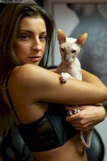 Melena Maria Rya Showing Her Cat While Posing In Black Lingerie Photos