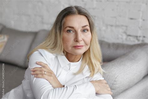 Portrait Of Attractive Mature Blonde Woman With Natural Makeup Posing