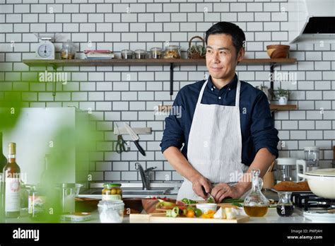 Japanese Mature Man In The Kitchen Stock Photo Alamy