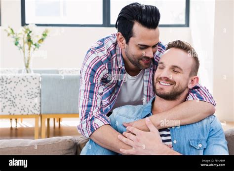 Gay Couple Relaxing On The Couch Stock Photo Alamy