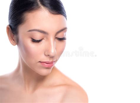 Beauty Smiling Model With Natural Nude Make Up And Long Eyelashes Holding Lipstick Stock Photo
