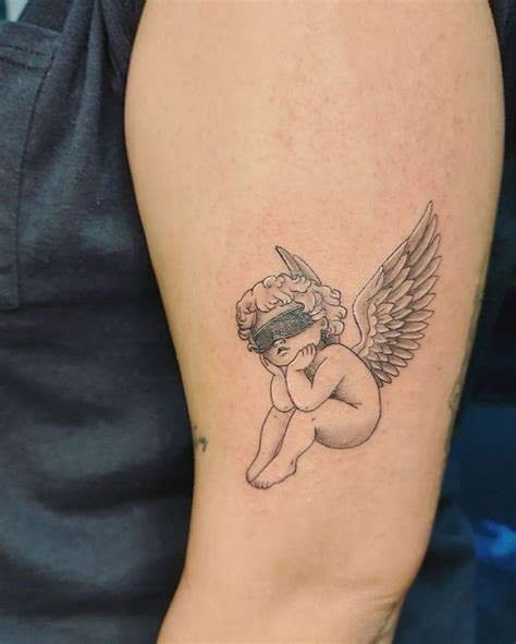 Pin By J Ssica Idalio On Tatuagens In Cupid Tattoo Cherub