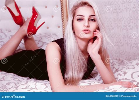 Portrait Of Beautiful Blonde Woman In Dress And High Heels On Be Stock Photo Image Of