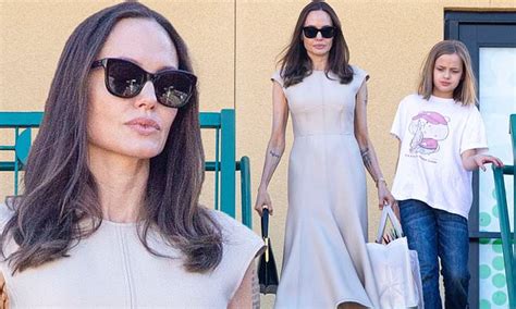Angelina Jolie Bares Tattooed Sleeves In Nude Dress While Christmas Shopping With Daughter