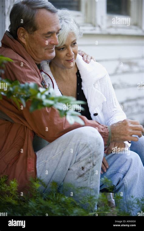 Mature Couple Sitting Together Outside Stock Photo Alamy