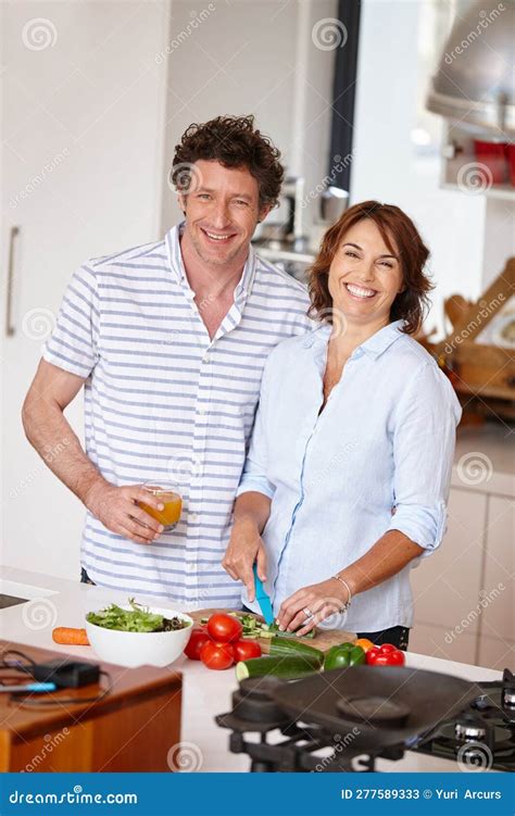 Home Cooked Goodness Portrait Of A Happy Mature Couple Cooking A Healthy Meal Together At Home