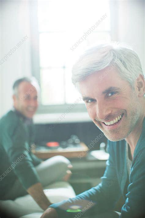 Gay Couple Relaxing With Record Player Stock Image F Science Photo Library
