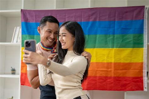 Premium Photo An Attractive Asian Girl Is Taking Selfies Or Recording Vlog With Her Gay Friend