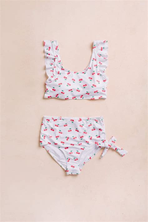 Rihanna Puts On Cheeky Display In Cherry Printed Bikini As She Shows