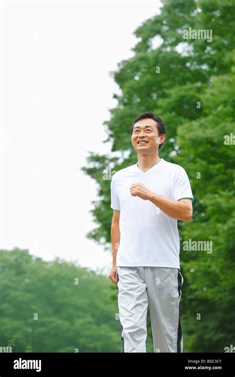 Mature Man Walking Stock Photo Alamy