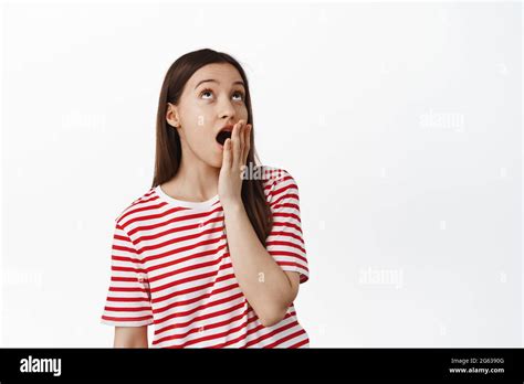 Image Of Silly Brunette S Girl Express Boredom Looking Up And Yawning Cover Opened Mouth