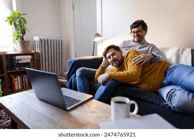 Gay Male Couple On Sofa Cuddling Stock Photo Shutterstock