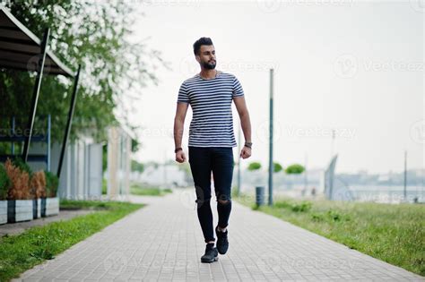 Handsome Tall Arabian Beard Man Model At Stripped Shirt Posed Outdoor