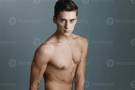 Cropped View Portrait Of Handsome Man With Naked Torso On Gray Background Stock Photo