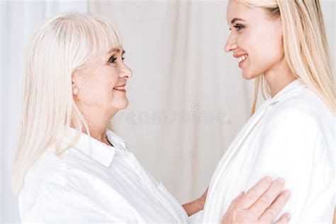 Smiling Blonde Grandmother And Granddaughter In Stock Image Image Of