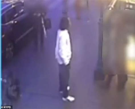 Shocking moment a thug PUNCHES woman in the nose on the NYC subway