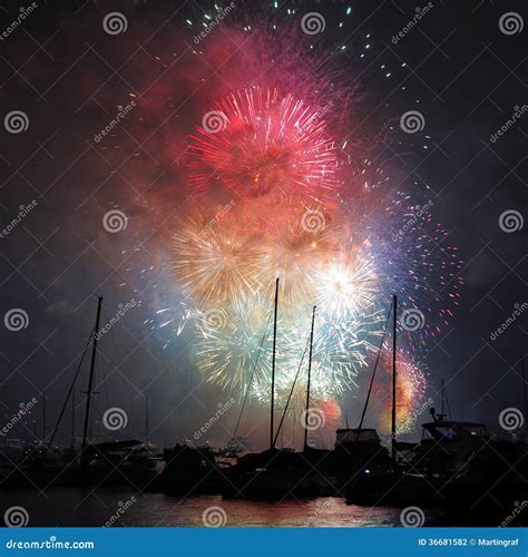 Colorful Fireworks In Harbor Over Sailing Boats Night Scenery Stock