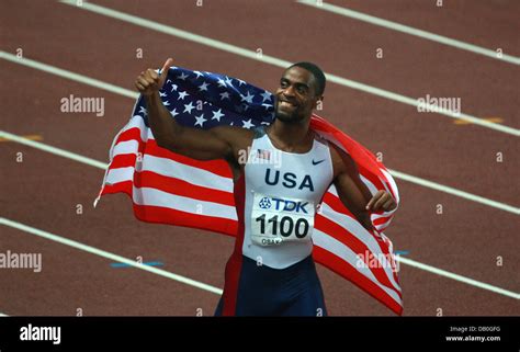 US American Sprinter Tyson Gay Holds An American Flag While Celebrating His Victory In The Men S