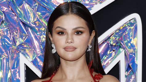 Selena Gomez Is Red Hot In A Low Cut Floral Gown With A Sizzling Thigh High Slit As She Attends