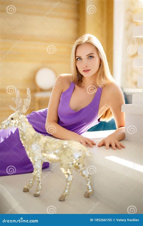 Beautiful Sunny Portrait Of A Blonde Girl Beautiful Woman With A Brilliant Shining Deer Stock