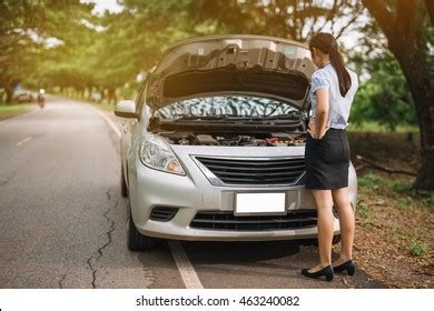 Attractive Brunette Front Her Car Broken Stock Photo
