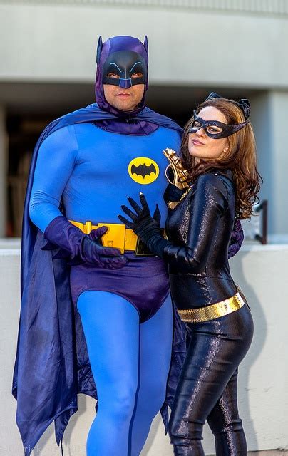 Two People Dressed Up As Batman And Catwoman