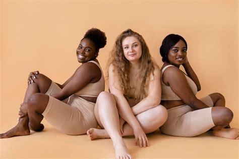 Premium Photo Three Women In Nude Body Shapers Posing Together
