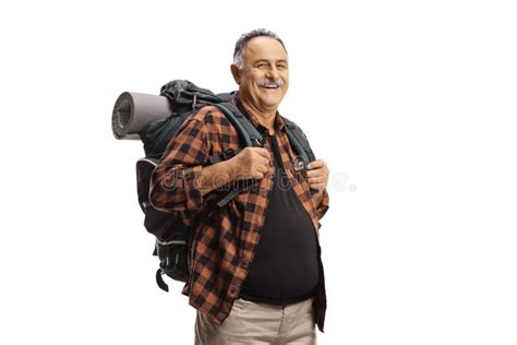 Smiling Mature Man With A Backpack Standing And Smiling Stock Photo