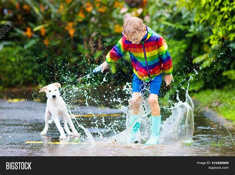 Kid Dog Playing Rain Image And Photo Free Trial Bigstock