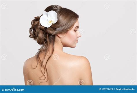 Portrait Of A Beautiful Sensual Light Brown Haired Woman With A Wedding Hairstyle And Nude Make