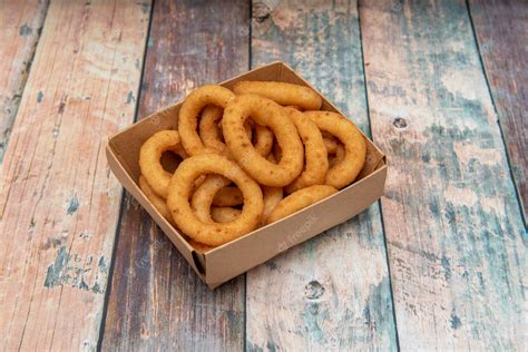 Premium Photo Onion Rings Battered In Flour And Egg And Then Fried In