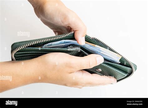 Female Hands Taking Money Out Of A Wallet On A White Background Stock