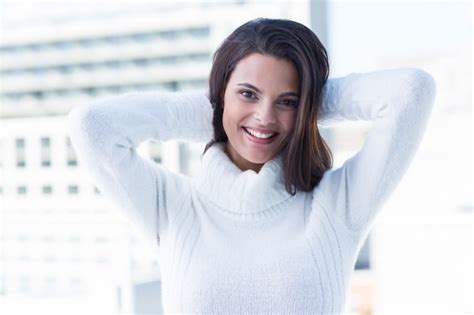 Premium Photo Pretty Brunette Smiling At Camera With Heads On Head