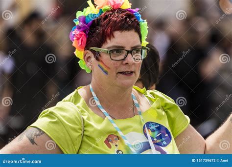 A Woman With Rainbow Flowers In Hair Attending The Gay Pride Parade Also Known As Christopher