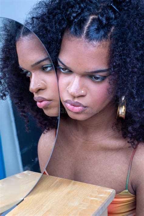 Portrait Of A Beautiful Hot Model With Curly Hair Posing In Front Of A Mirror Stock Image