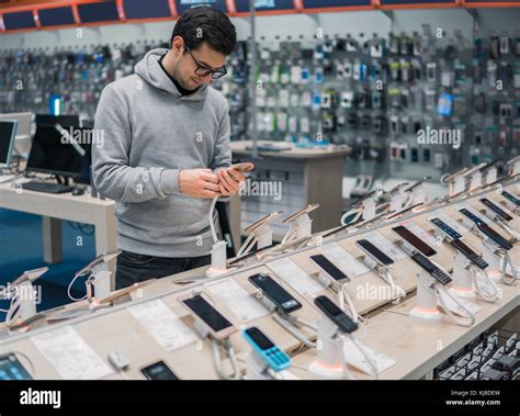 Smart Male Customer Choosing Smartphone Stock Photo Alamy