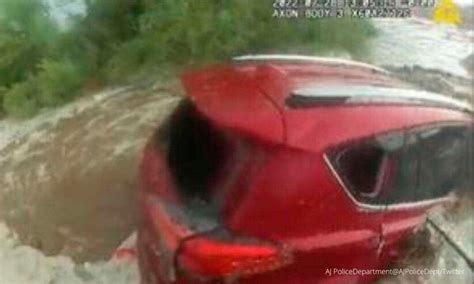 Police Daringly Rescue A Woman From A Car Stuck In Floods Video Viral