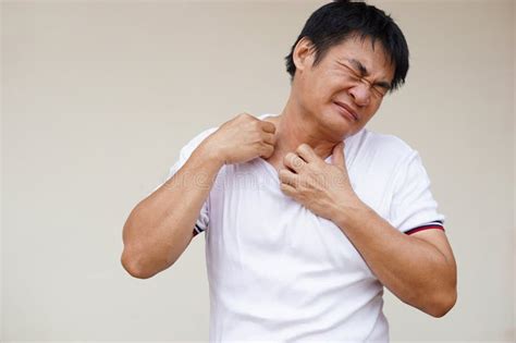 Asian Man Feels Hot Uncomfortable Unhappy With Hot Weather Sweltering Condition Stock Photo