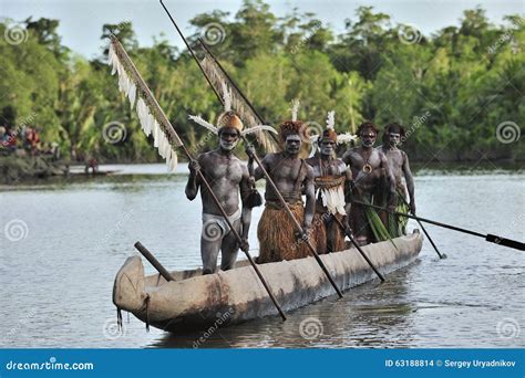 Canoe War Ceremony Of Asmat People. Headhunters Of A Tribe Of Asmat ...