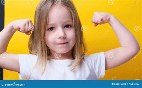 Strong Power Preschool Little Girl Flexing Arm Muscle Smile Posing