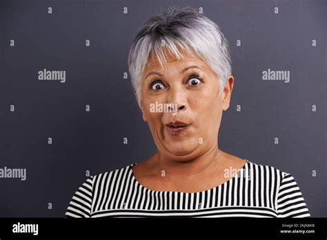 Did You Say Cake Portrait Of A Mature Woman With An Excited Look On Her Face Stock Photo Alamy