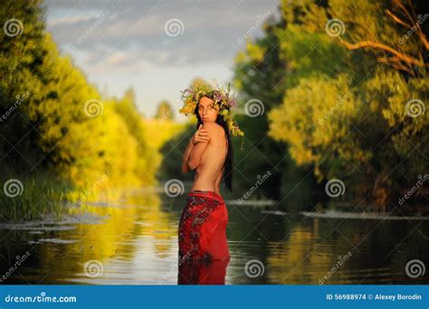 Topless Long Haired Brunette Girl In Red Skirt And Grass Wreath Stock Photo Image Of Blue