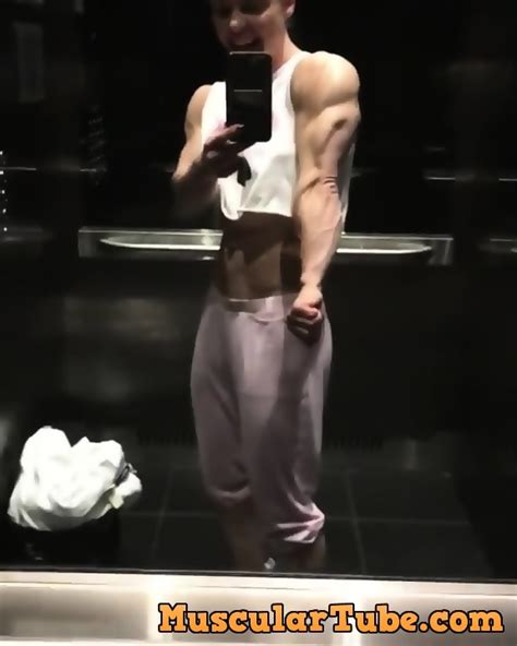 Stunning Blonde Muscle Woman Admires Herself In Elevator Mirror