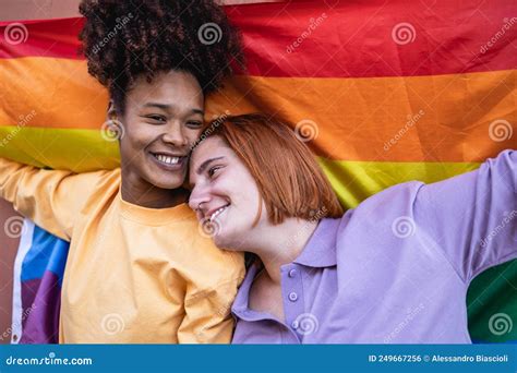 Happy Gay Couple Celebrating Pride Holding Rainbow Flag Outdoor Stock Photo Image Of Gender