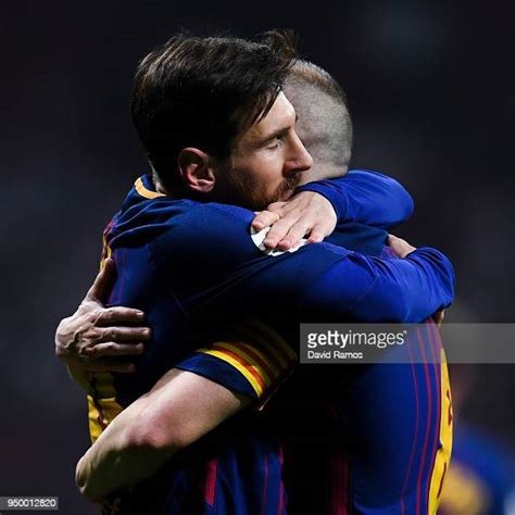 Lionel Messi Of Fc Barcelona Hugs His Team Mate Andres Iniesta Of Fc