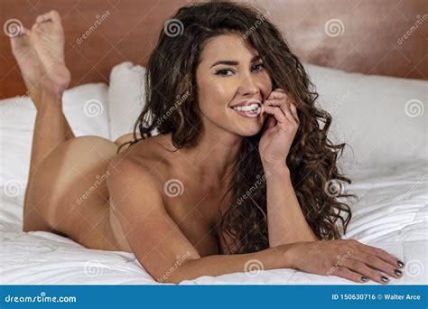 A Lovely Brunette Lingerie Model Poses Nude In A Home Environment Stock Photo Image Of