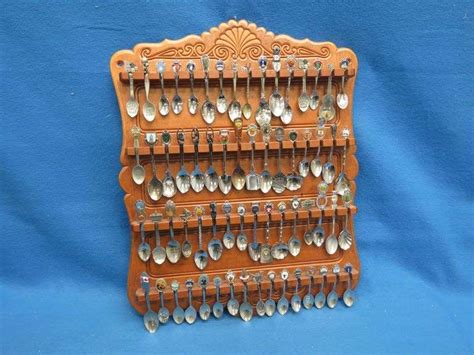 64 Collectible Souvenir Spoons and Display Rack - AAA Auction and Realty