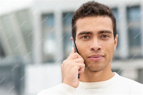 Free Photo Handsome Man Talking On The Phone