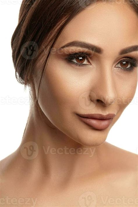 Close Up Portrait Of A Brunette Nude Model Girl With Professional Evening Make Up And Plump Lips