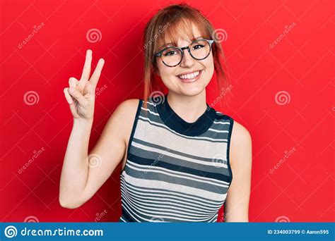 Redhead Young Woman Wearing Casual Clothes And Glasses Smiling With